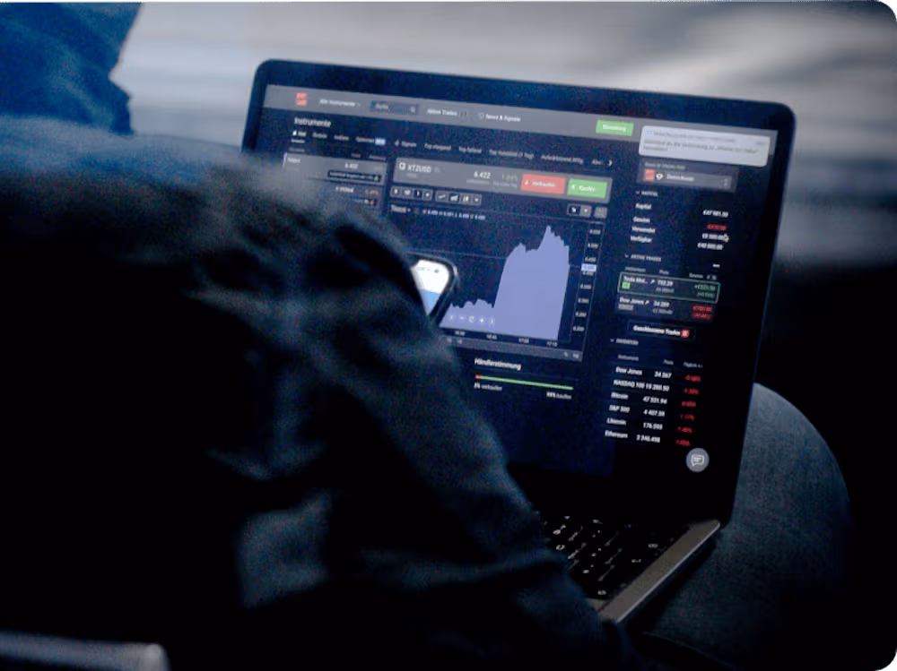 Trader reviewing live market charts on a mobile device